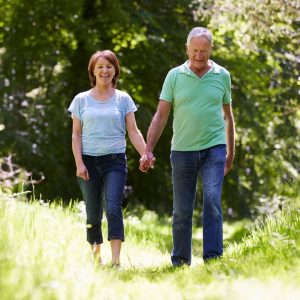 Older couple going for a walk