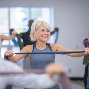 Older woman using resistance bands
