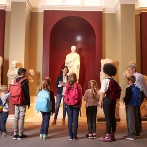 Woman leads museum tour group