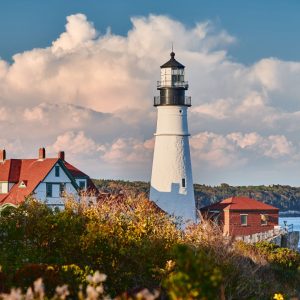 Landscape image of the Portland Head Lighthouse in summertime