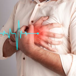 We can see a man's chest, with one hand grasping at the left side. There is red overlaying where he's grabbing to indicate pain, and there is a blue line that looks like an EKG leading to the red