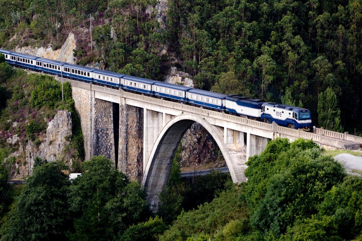 The Transcantábrico travels over a viaduct in Luarca