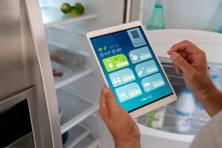 smart refrigerator settings being adjusted by tablet