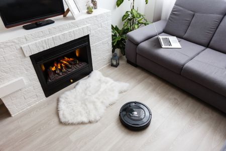 robot vacuum on floor of living room