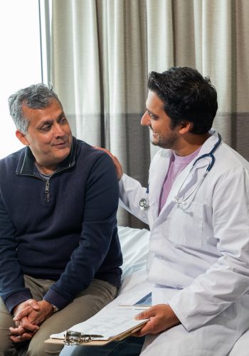 senior man consults with male doctor