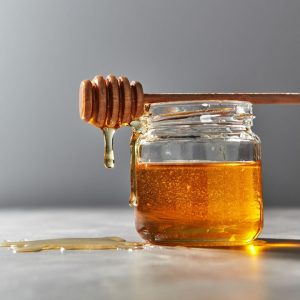 Dripping honey from a jar - Photo by JanPietruszka via Canva and Getty Images
