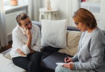 Breaking Up with Your Therapist Concerned woman talks with her therapist_how to break up with your therapist featured image -Source: Karola G from Pexels, via Canva.com