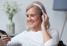 Music Streaming Services: Features, Pricing and Hidden Gems Modern senior woman in earphones enjoy music by fizkes from Getty Images