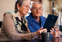 Should You Trust “Dr. ChatBot?” senior couple consults tablet screen