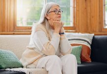 Widowed After 55: Your First Steps for Estate Administration Mature woman sitting on sofa_Widowed after 55 featured image