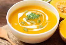 Roasted Butternut Squash Soup with Coconut-Lime Crema Photo of a bowl of butternut soup with a decorative Coconut-Lime Crema circle through it
